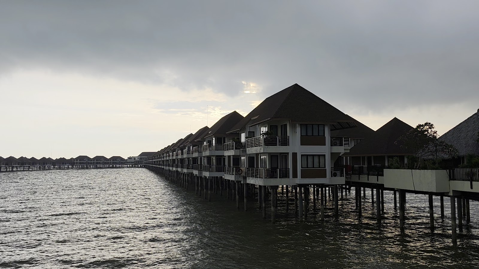 Avani Sepang Goldcoast Resort overwater villa — lagoon