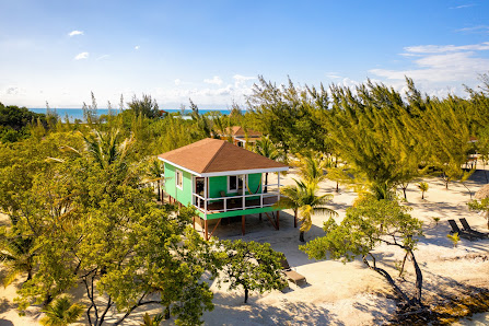 Coco Plum Island Resort overwater villa — lagoon