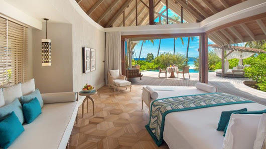 Coco Plum Island Resort overwater villa — interior