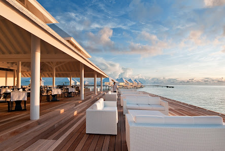 Diamonds Athuruga Maldives overwater villa — lagoon