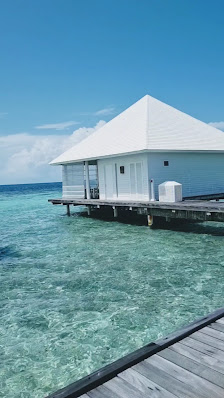 Diamonds Athuruga Maldives overwater villa — deck
