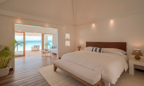 Diamonds Athuruga Maldives overwater villa — aerial