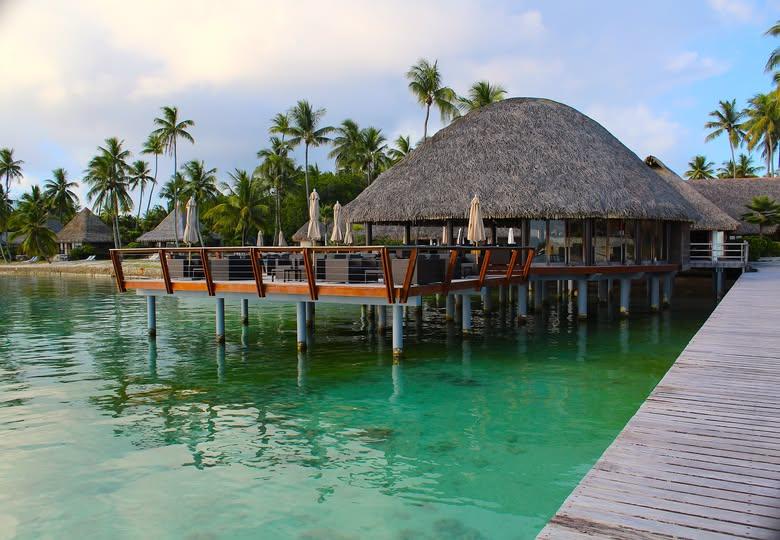 Hotel Kia Ora Resort & Spa overwater villa — aerial