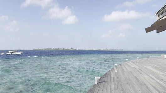 Kudadoo Maldives Private Island overwater villa — lagoon