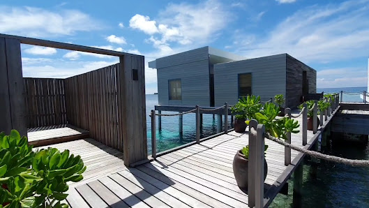 Raffles Maldives Meradhoo overwater villa — aerial