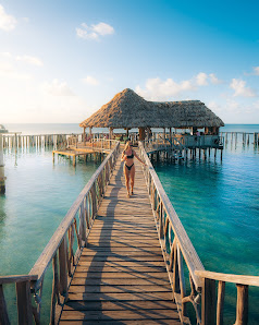 Thatch Caye Resort, a Muy'Ono Resort overwater villa — lagoon