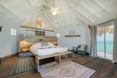 Thatch Caye Resort, a Muy'Ono Resort overwater villa — aerial
