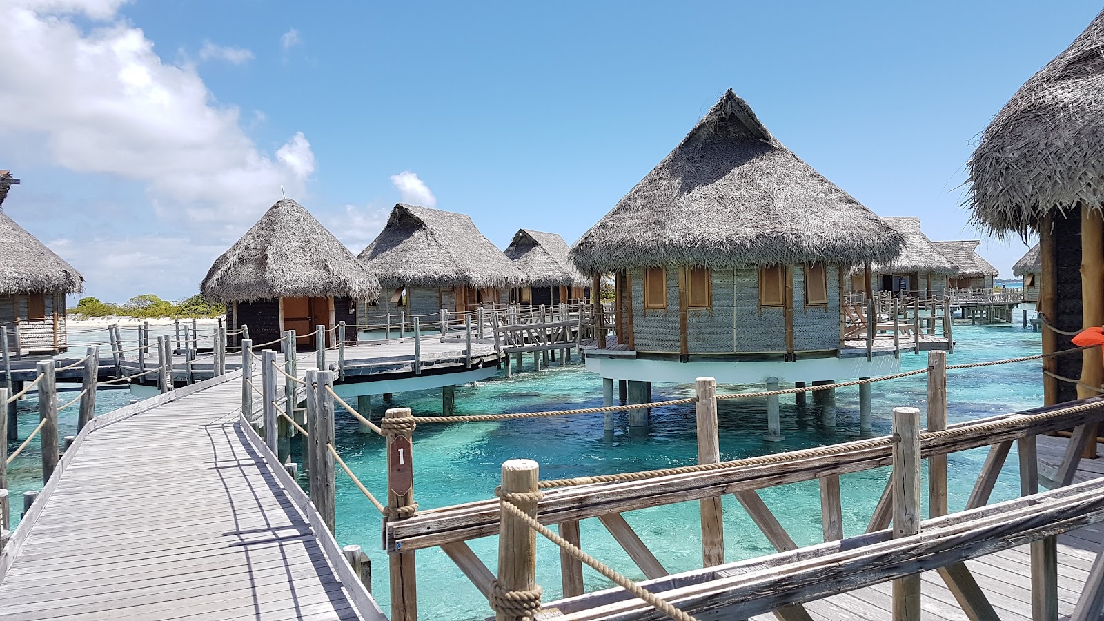 Le Tikehau by Pearl Resorts overwater villa — aerial